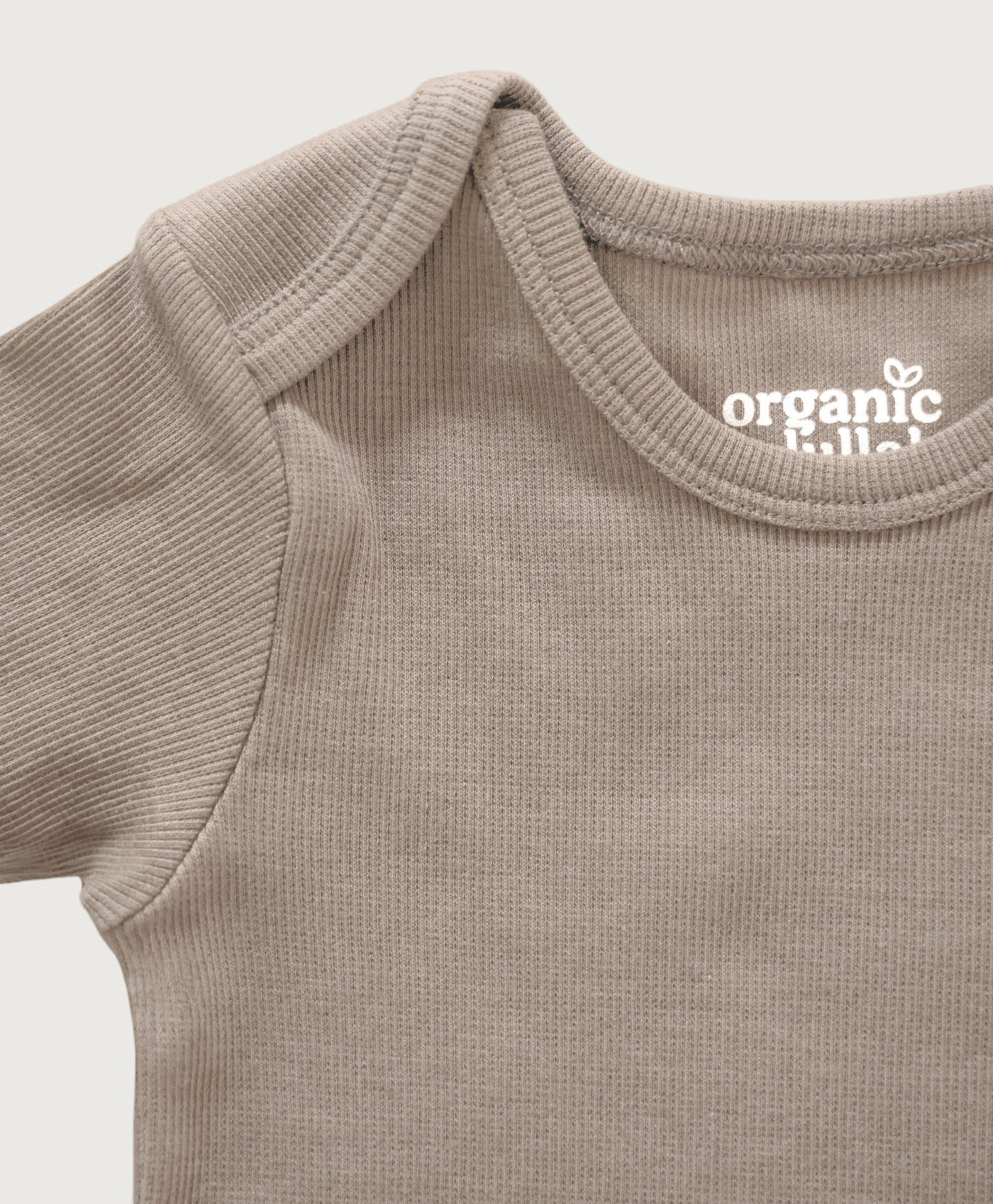 Beige kortærmet rib bodystocking i Gots-certificeret økologisk bomuld fra Organic Lullaby
